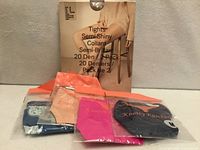 Full lot showing tights pack and four packaged underwear