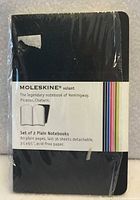 Front view of sealed Moleskine volant set showing brand band and product details