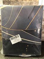 Factory-sealed package showing folded duvet cover with barcode label