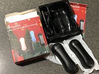 Box, charging tray, cable, two hand warmers