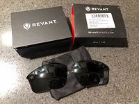 Lenses, microfiber pouch, two Revant boxes
