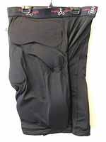Front view of black Triple Eight padded shorts showing foam panel contours and waistband branding