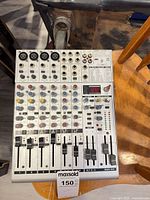 Top view of mixer showing entire control surface, faders, knobs and I/O panel