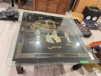 Overall view of square coffee table with glass overlay