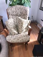 Front view of Dutailier glider with cushions