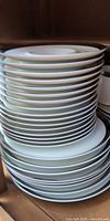 stack of white plates with platinum rim