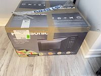 Boxed Panasonic microwave front view