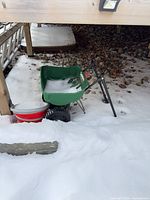Full view of spreader under deck in snow