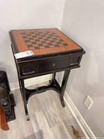 Full view of table showing chessboard top, apron and legs