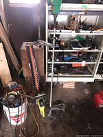Both trimmers standing in garage showing overall condition
