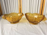 Pair of amber pressed glass bowls, full view