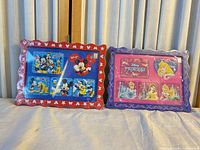 Front view of both sealed Disney photo frames