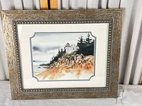 Full view of framed lighthouse watercolor