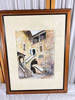 Full view of framed painting showing wood frame, mat, artwork