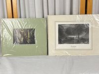 Both matted prints side by side in plastic wrap