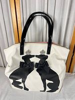 Front view showing dog silhouettes, bows and rhinestone crowns