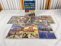 Outer box front and eight visible DVD cases laid out