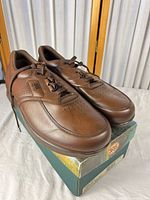 Oblique view of pair of brown SAS Time Out shoes on original box