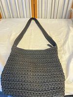 Front view of black crocheted crossbody bag