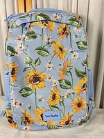 front view of backpack showcasing sunflower print