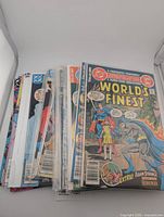 Stack of bagged "World's Finest" comics showing spines and top issue