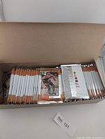 Open box displaying rows of sealed Upper Deck McDonald's 1999 hockey card packs