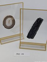Both acrylic displays showing tourmaline and agate specimens