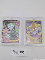 Front view of both Pokémon cards in cases