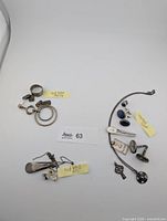 Overview of entire lot showing three grouped sections of jewelry and scrap