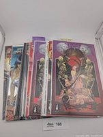 Stack of eight bagged comic books, front shows purple Donna Mia foil cover and others underneath