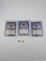 Front view of three sleeved Lotus Petal cards