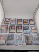 All 15 sleeved cards laid out in rows