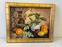 Full view of framed still-life painting, showing subject, frame style and proportions