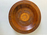 Top view showing inscription, carved design and overall condition