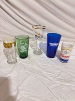 Group shot of all five branded beer glasses
