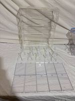 Complete lot showing display case, twelve easel stands, and hinged pockets