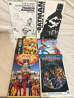 All six DC Comics graphic novels laid out