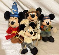 Group shot of all four Mickey Mouse bean bag plush toys in various costumes