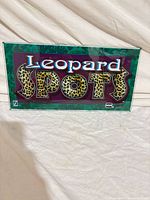 Front view of Leopard Spots glass marquee