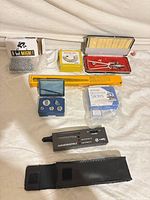 All items laid out: tester, pouch, mandrel, ring gauge, ring sizer stick, ring insert set, slides box, magnet box