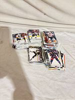 Stacks of hockey trading cards on table