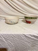 Front view of both bowls side by side showing exterior patterns