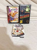 Group shot of three game boxes: Avatar QuickStrike, Boss Monster, Kittens in a Blender