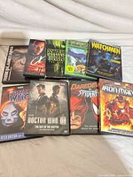 All nine DVD cases laid out, front covers visible