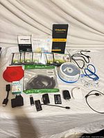 Overview of all blank media packs, cables, adapters and accessories laid out
