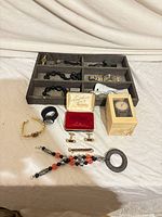 Overview of tray, watches, jewellery, cufflinks, boxed watch