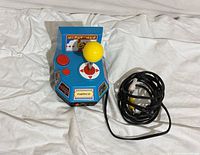 Top and side view of joystick and attached RCA cable