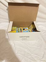 Box containing stacks of Pokémon cards