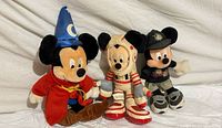All three Mickey Mouse bean bag plush dolls side by side