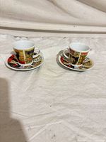 Two demitasse cups with matching saucers, full set view